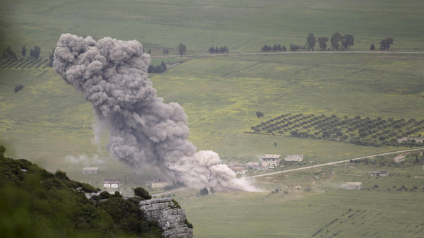 Smoke rises after what rebel fighters said was an air strike by forces of Syria's President Bashar al-Assad on the Al-Ghab plain in the Hama countryside April 22, 2015. Picture taken April 22. REUTERS/Khalil Ashawi